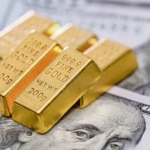Finance,Concept,Gold,Bullion,Lie,On,100,Us,Dollar,Bills